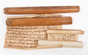 MESOPOTAMIA: A pair of bamboo rods containing hand-made paper rolls bearing good luck, prayers and blessings (two scrolls in one and four scrolls in the others), early 1800s, the larger 21cm across