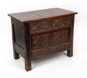 An antique English oak coal box constructed from 17th century panelling with scroll carved front and peg jointed construction, circa 1900, 51cm high, 62cm wide, 36cm deep.