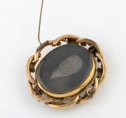 An antique pinchbeck brooch with double-sided ambrotype photo portraits, 19th century, ​​​​​​​7cm high - 2