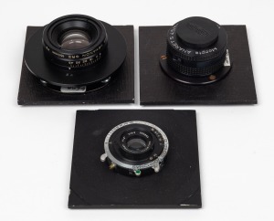 VARIOUS MANUFACTURERS: Group of three lenses on lens boards - one Dallmeyer Anastigmat 2" f3.5 [#543082] with Synchro-Compur shutter, one Konica Hexanon GRII 150mm f9, and one Meopta Anaret S 50mm f4.5 [#2961] with Meopta front lens cap. (3 items)