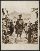 CRIME AND PUNISHMENT: Twenty-one 1930s press photographs, the largest 20.5 x 25cm, depicting various United States crime scenes and dramas, together with images from various other countries including a striking image taken in Lhasa, Tibet of a condemned m
