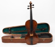An antique German trade violin with bow in mahogany veneered case, the violin with internal label "Copy of Nicolaus Amatus Fecit Made in Germany'", the violin 60cm long, the case 80cm long.