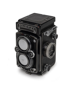 ROLLEI: Rolleiflex 3.5 E2 Model 2 (K4C3) TLR camera [#1864034] with Xenotar 75mm f3.5 lens [#5233398], Rollei F&H twin lens cap, Rolleiflex leather case, and instruction booklet, c. 1961.