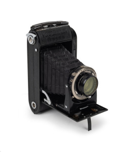 VOIGTL&Auml;NDER: Bessa RF folding rangefinder camera [#J645725] with rare Heliar 105mm f3.5 lens [#2068744] featuring integrated lens filter, Compur-Rapid shutter, and Voigtl&auml;nder leather case, c. 1942.