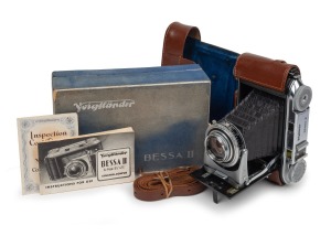 VOIGTL&Auml;NDER: Bessa II folding rangefinder camera with rare Color-Heliar 105mm f3.5 lens [#3589221],&nbsp;Synchro-Compur shutter, leather case, instruction booklet, inspection certificate, and maker's box,&nbsp;c. 1950.