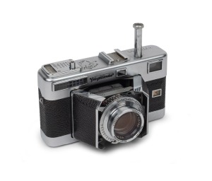 VOIGTL&Auml;NDER: Vitessa L (Type 140) viewfinder camera with rare Ultron 50mm f2 lens [#3676597], Synchro-Compur shutter, Voigtl&auml;nder 133/29 UV lens filter, and Voigtl&auml;nder leather case, c. 1954.
