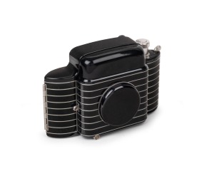 KODAK: Bantam Special folding 828 film camera [#5201383] with&nbsp;Ektar 45mm f2 lens [#8789] and&nbsp;Compur-Rapid shutter, c. 1942. Much admired for its black and silver Art Deco&nbsp;styling.