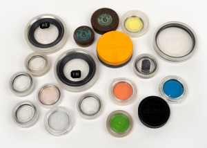 KODAK: An accumulation of eighteen lens filters of varying size, colour, and vintage, each in original Kodak plastic lens case. (18 items)