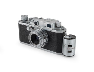 CANON: Canon IVSB rangefinder camera [#78571] with Canon Serenar 28mm f3.5 lens [#12543], Canon Self-Extension Adapter, and Canon leather case, c. 1953.