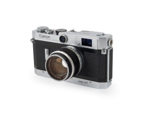 CANON: Canon VI-T rangefinder camera [#617745] with Canon 50mm f1.8 lens [#295500], Canon UV lens filter, and Canon leather case, c. 1959.