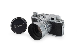 CANON: Canon IIS2 rangefinder camera [#187397] with Canon 50mm f1.8 lens [#144601], Walz lens filter, Canon lens hood, and Canon lens cap, c. 1955.