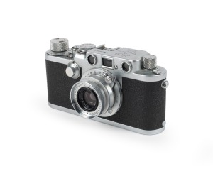 LEITZ: Black-dial Leica IIIf rangefinder camera [#643433] with Summaron 35mm f3.5 lens [#1062613], Leica leather case, and instruction booklet, c. 1953.