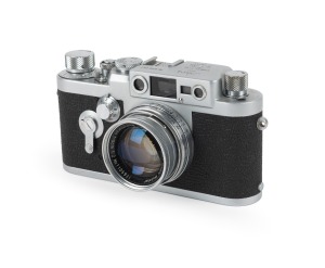 LEITZ: Leica IIIg rangefinder camera [#879042] with Summicron 50mm f2 lens [#1105931] and instruction booklet, c. 1958.