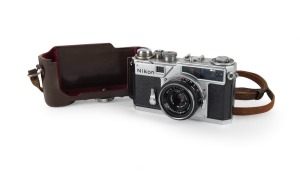 NIPPON KOGAKU: Nikon SP rangefinder camera [#6212003] with W-Nikkor&middot;C 35mm f3.5 lens [#440194] and Nippon Kogaku leather half-case, c. 1960.