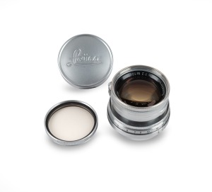 LEITZ: Collapsible screw-mount Summicron 50mm f2 lens [#1043859] with Leitz UVa lens filter, Leica front and rear lens caps, and Leitz leather lens case.