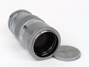 CANON: Screw-mount Canon 135mm f3.5 lens with Canon Series VII lens hood and Canon front and rear lens caps.