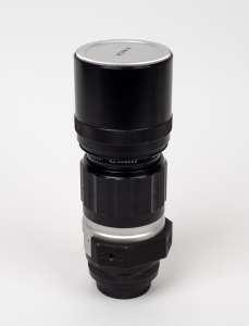 NIPPON KOGAKU: F-mount Nikkor-H Auto 300mm f4.5 lens with Nikon front and rear lens caps.