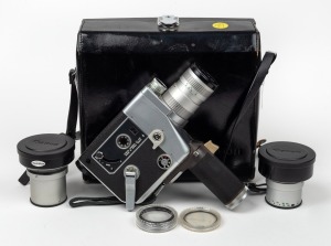 CANON: Cine Zoom 512 8mm movie camera with Canon C-8 8.5-42.5mm f1.2 lens, Canon C-8 Power Grip, and Canon lens cap, offered in Canon leather case with two Canon lens converters and two Canon lens filters, c. 1964.