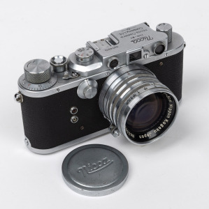 NICCA: Nicca IIIs rangefinder camera [#54919] with Nippon Kogaku Nikkor-S&middot;C 50mm f1.4 lens [#333290], Nicca lens cap, and Nicca leather case, c. 1952.