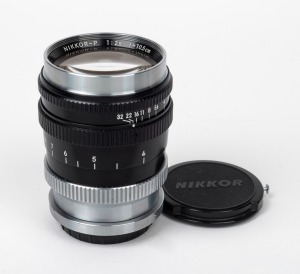 NIPPON KOGAKU: Bayonet-mount Nikkor-P 105mm f2.5 lens [#921192] with Nikkor front and rear lens caps.