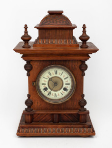 An antique American timber cased mantle clock with eight day time and coil gong striking movement, 19th/20th century, 37cm high.