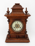 An antique American timber cased mantle clock with eight day time and coil gong striking movement, 19th/20th century, 37cm high.