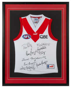 SWANS BROWNLOW MEDALLISTS: Display comprising Swans window-mounted guernsey with original signatures of Barry Round, Adam Goodes, Paul Kelly, Bobby Skilton, Greg Williams, Gerard Healy, Fred Goldsmith, Peter Bedford, and Graham Teasdale, framed and glazed