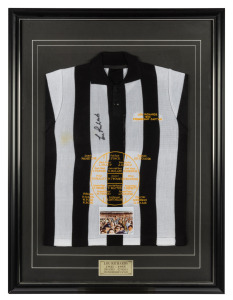 COLLINGWOOD: a souvenir Collingwood guernsey commemorating "Lou Richards 1953 premiership captain", signed by Lou Richards, showing all the players in the team in position, attractively framed and glazed, Overall 111 x 83cm.