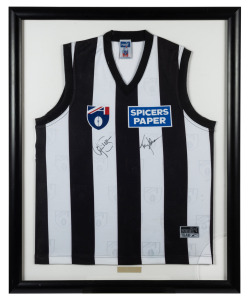A 1997 Collingwood team guernsey signed by the Coach, Tony Shaw and Captain, Gavin Brown, who was also that years Best and Fairest winner, Framed and Glazed, Overall 92 x 74cm.