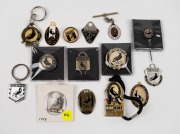COLLINGWOOD: A small collection of fobs and badges including a 1940s lapel pin, 1940s-50s tin badges and a fob on a silver chain, later membership fobs, a 10 Year Premier Pass, etc. (15 items).