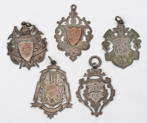 A group of silver (and silver+gold) award fobs to E.L. WAKELING, comprising of 1905-6 Bowling award (Glenlyon C.C.), 1905-6 Premiers (Glenlyon C.C.), 1907-8 Premiers (East Brunswick C.C.), 1908-9 Premiers (East Brunswick C.C.) and 1907 Best Field Umpire (M.J.F.A.), (5 items; total: 35g).