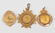 FOOTBALL: Various 1920s awards in gold (9ct, 14+g total.), engraved "VICTORIA F.C. Runners Up 1925 - T. HENDERSON"; "E.S.S.F.A. All Age - Won by J. LYONS - 1927"; and, "T.F.C. Premiers 1928 - A.W. ENGLEMAN". (3 items).