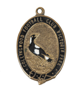 An exceptionally rare COLLINGWOOD LIFE MEMBERSHIP FOB: A gilt bronze and enamel fob with the club's magpie at the centre of a belt & buckle strap containing the words "COLLINGWOOD FOOTBALL CLUB VICTORIA PARK"; the reverse engraved "HON. LIFE MEMBER / A.R.