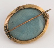 An antique oval yellow gold mourning brooch, set with a turquoise, with mourning window on reverse, 19th century, ​​​​​​​3.5cm wide, 6.7 grams total - 2