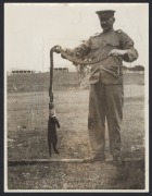 Nine c. 1940s press agency photographs, featuring the 1947 Caulfield Cup, Daredevil Curtis motorcycle jump at the Melbourne Exhibition Speedway, Australian Alps search and rescue volunteers in action, French Island koala colony transfer to Healesville, an - 3