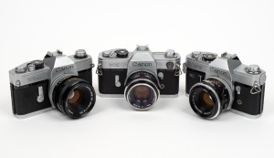 CANON: Group of three cameras - one Canon FX with Canon FL 50mm f1.8 lens, one Canon FT with Canon FL 50mm f1.8 lens, and one Canon TLb with Canon FD S.C. 50mm f1.8 lens. (3 items)