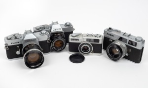 CANON: Group of four cameras - one Canon Pellix with Canon FL 50mm f1.4 lens, one Canon EXee with Canon EX 50mm fl1.8 lens, one Canonet QL19, and one Canon Demi EE28. (4 items)