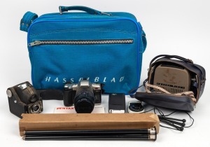 VARIOUS MANUFACTURERS: Hasselblad blue canvas bag containing more than ten camera items, including Ensign Ful-Vue camera, Kodak tripod, Pentax MZ-7 camera, Schneider-Kreuznach 8x loupe, and others. (10+ items)