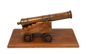 Miniature cast bronze working model cannon on timber stand, 20th century, the barrel 32cm long