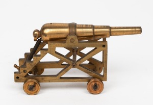 A scratch built cast brass miniature model cannon mounted on brass base, 20th century, 15cm long overall