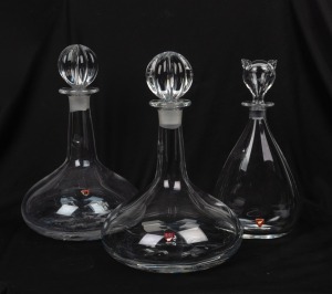 ORREFORS novelty decanter with cat stopper; together with a pair of ship style decanters, 20th century, (3 items), 27cm and 29cm high