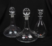 ORREFORS novelty decanter with cat stopper; together with a pair of ship style decanters, 20th century, (3 items), 27cm and 29cm high