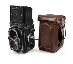 ROLLEI: Rolleiflex 2.8F TLR camera [#2457761], c. 1956, with Carl Zeiss Planar 80mm f2.8 lens [#4350568], together with leather casing.