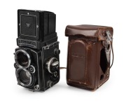 ROLLEI: Rolleiflex 2.8F TLR camera [#2457761], c. 1956, with Carl Zeiss Planar 80mm f2.8 lens [#4350568], together with leather casing.