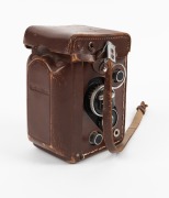 ROLLEI: Rolleiflex 2.8F TLR camera [#2457761], c. 1956, with Carl Zeiss Planar 80mm f2.8 lens [#4350568], together with leather casing. - 6