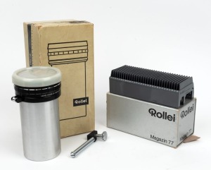 ROLLEI: Vario-Heidosmat 110-160mm f3.5 projector lens in maker's box with cap, together with Magazin 77 slide tray in maker's box. (2 items)