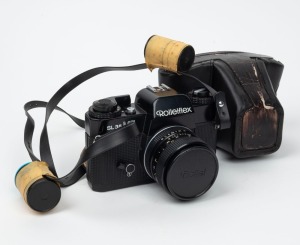ROLLEI: Rolleiflex SL 35 ME SLR camera [#4911489], c. 1976, with Planar 50mm f1.8 lens [#1120452], together with front lens cap and leather case.