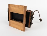 THORNTON-PICKARD: Twin Beck Symmetrical lenses, both with original leather caps, mounted on Thornton-Pickard 'Time & Inst.' roller-blind shutter, together with Watson Bowden 'The Antinuous' shutter release cable, c. 1900s. - 2