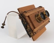 THORNTON-PICKARD: Twin Beck Symmetrical lenses, both with original leather caps, mounted on Thornton-Pickard 'Time & Inst.' roller-blind shutter, together with Watson Bowden 'The Antinuous' shutter release cable, c. 1900s. - 4