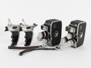 BOLEX-PAILLARD: Two c. 1958 double-8 movie cameras, both with pistol-grip attachment, wrist strap, and all lens caps present. (2 movie cameras)